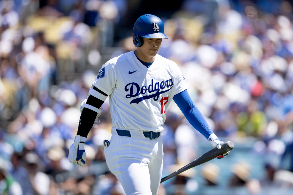 Los Angeles Dodgers' Shohei Ohtani walks off the field during the third inning of a baseball game against the Milwaukee Brewers, Sunday, Aug. 16, 2026, in Los Angeles. (Eric Thayer/Los Angeles Times via AP)