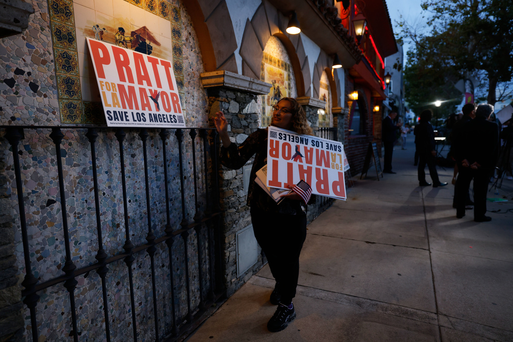 Signs are placed outside of a restaurant holding an election night event for Spencer Pratt, a candidate in the Los Angeles mayoral race, on Tuesday, June 2, 2026, in Los Angeles. (AP Photo/Jill Connelly)