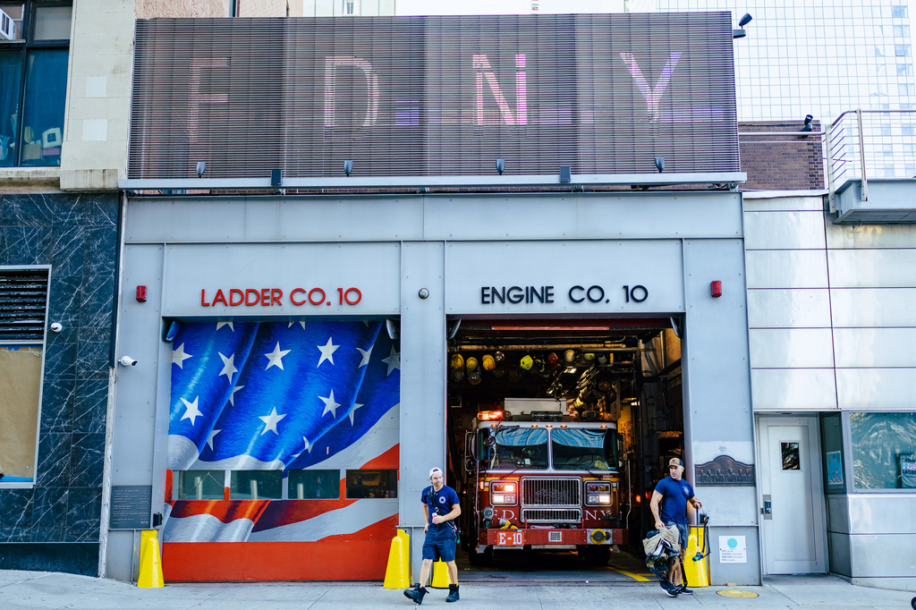 FDNY "Ten House" firefighters work near Ground Zero, 25 years after the Sept. 11, 2001, attacks, on Friday, Aug. 7, 2026 in New York. (AP Photo/Angelina Katsanis)