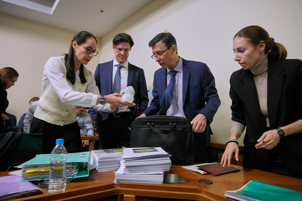 Participants gather in Moscow's Arbitration Court to hold a hearing to consider a lawsuit by Russia's Central Bank against Belgium-based financial clearinghouse Euroclear in Moscow, Russia, Friday, Jan. 16, 2026. (AP Photo/Pavel Bednyakov)