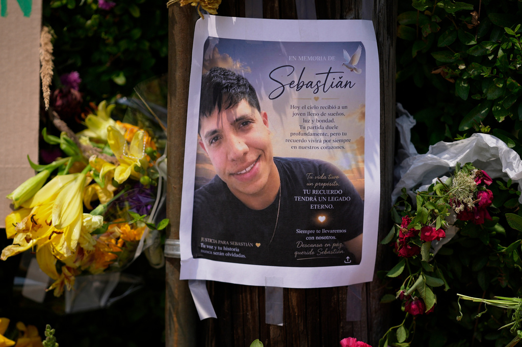 FILE - A poster of Johan Sebastián Durán Guerrero, a man killed by U.S. Immigration and Customs Enforcement, is displayed among flowers and tributes at a makeshift memorial in Biddeford, Maine, July 15, 2026. (AP Photo/Robert F. Bukaty, File)