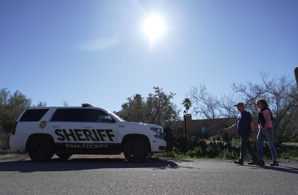 A Pima county sheriff's vehicle is parked out front of Nancy Guthrie’s home on Sunday, Feb. 8, 2026 in Tucson, Ariz. (AP Photo/Ty ONeil)
