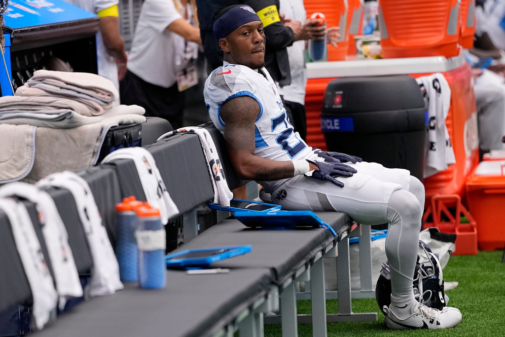 Tennessee Titans cornerback Marcus Harris sits on the bench during the second half of an NFL football game against the Houston Texans, Sunday, Sept. 28, 2025, in Houston. (AP Photo/David J. Phillip)
