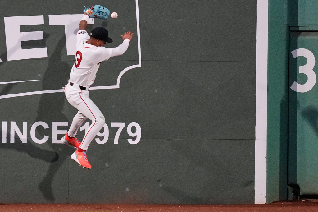 Boston Red Sox's Ceddanne Rafaela misses the catch on a triple by Atlanta Braves' Austin Riley during the sixth inning of a baseball game, Tuesday, May 26, 2026, in Boston. (AP Photo/Charles Krupa)
