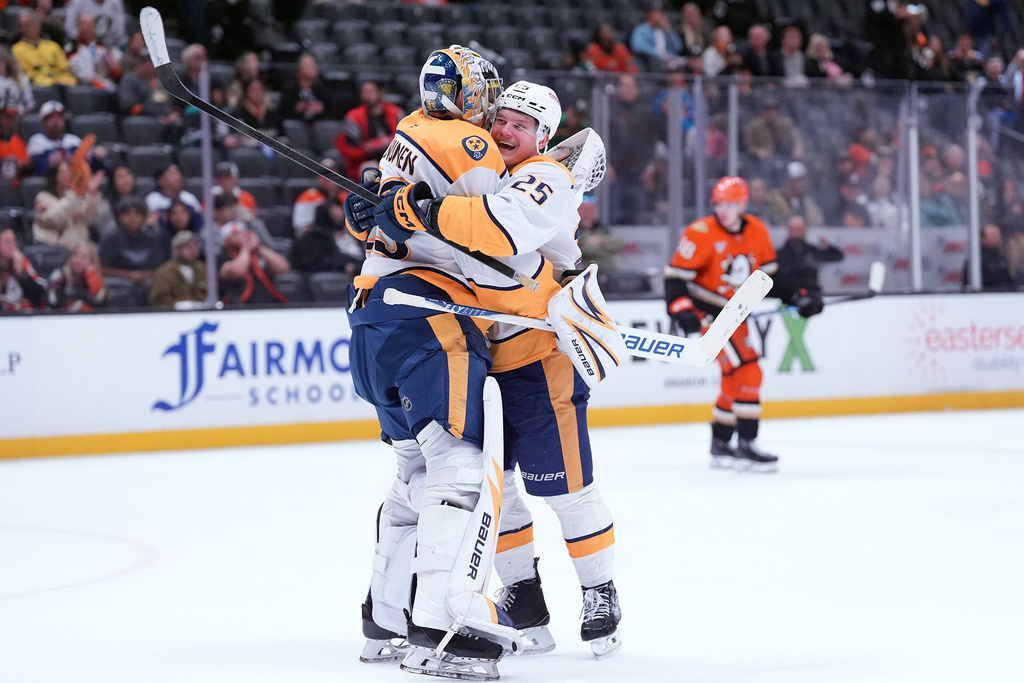 Nashville Predators' right wing Joakim Kemell (25) hugs goaltender Justus Annunen (29) after an NHL hockey game against the Anaheim Ducks, Tuesday, April 7, 2026, in Anaheim, Calif. (AP Photo/Scott Strazzante)