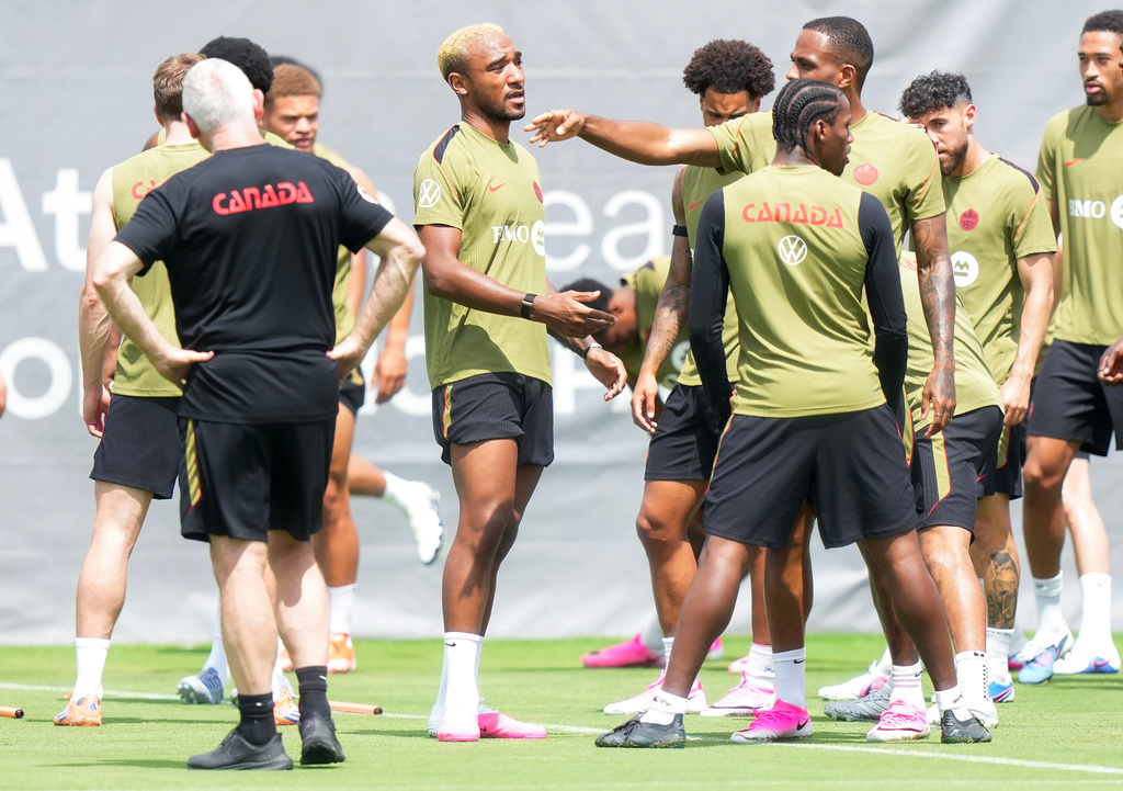 Canada defender Derek Cornelius, center, warms up during the selection camp for Canada&rsquo;s national soccer team, Thursday, May 28, 2026, in Charlotte, N.C., ahead of the FIFA World Cup soccer tournament. (Nathan Denette/The Canadian Press via AP)
