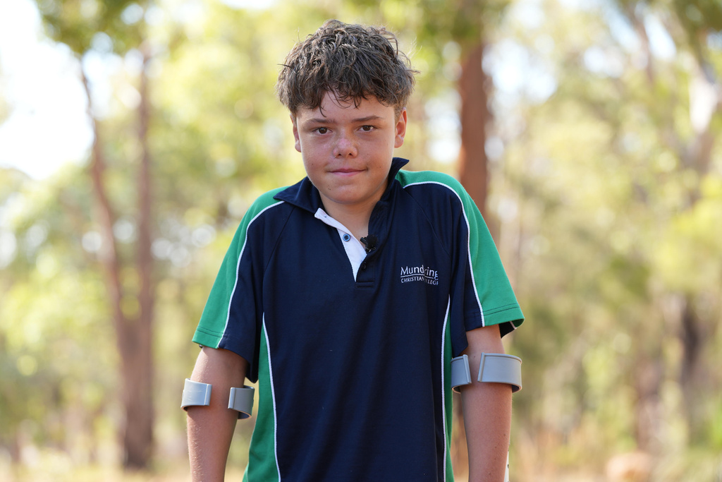 Austin Appelbee poses for a photo in Gidgegannup, Australia, Tuesday Feb. 3, 2026, after the 13-year-old made an hourslong swim to raise an alarm after his family was swept out to sea off the Australian coast. (Briana Shepherd/ABC via AP)