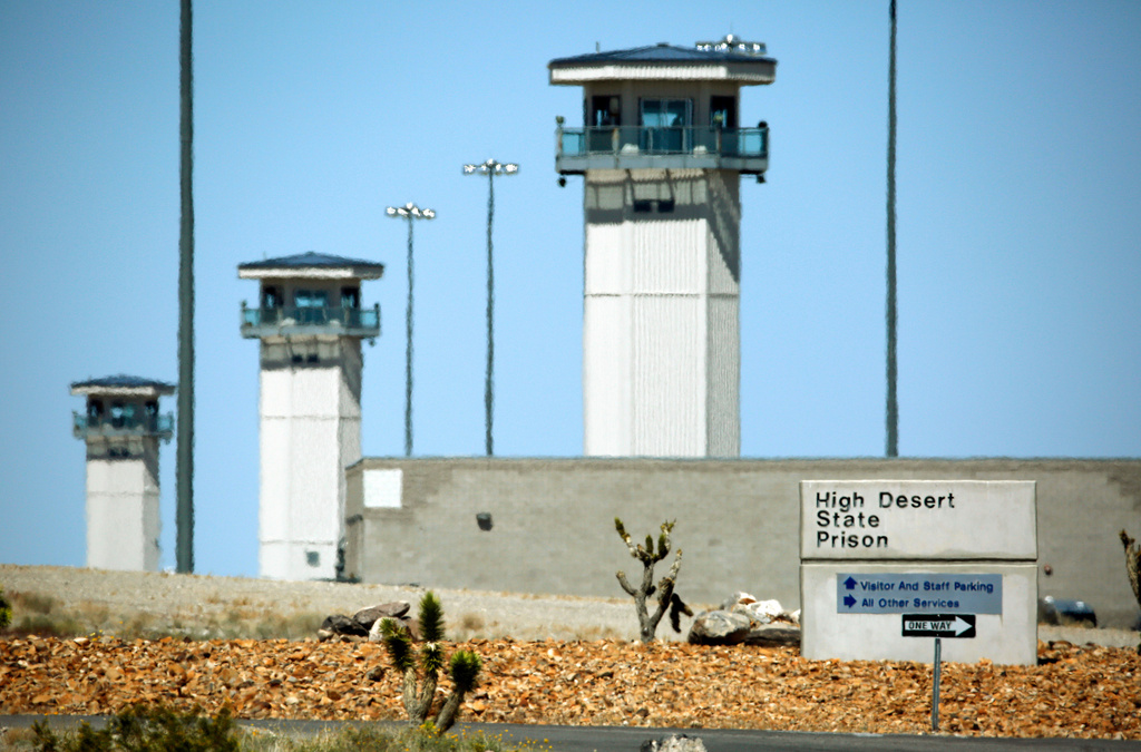 FILE - Towers are seen over the High Desert State Prison in Indian Springs, Nev., April 15, 2015. (AP Photo/John Locher, File)