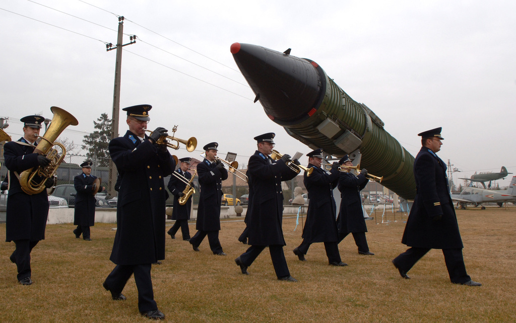 FILE - A Hungarian military orchestra marches through the site of the new spectacle, a Soviet SS-24 intercontinental ballistic missile, erected by the Technical Museum of War in Kecel, Hungary, 160 km south of Budapest Tuesday, Nov. 15. 2005. (AP Photo/Bela Szandelszky, File)