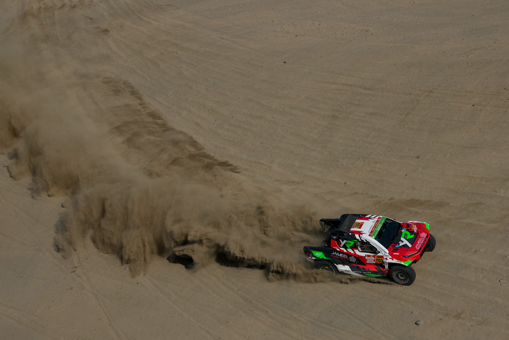 Driver Yawed Al Rahji and co-driver Timo Gottschalk compete during the first stage of the Dakar Rally in Yanbu, Saudi Arabia, Sunday, Jan. 4, 2026. (AP Photo/Thibault Camus)