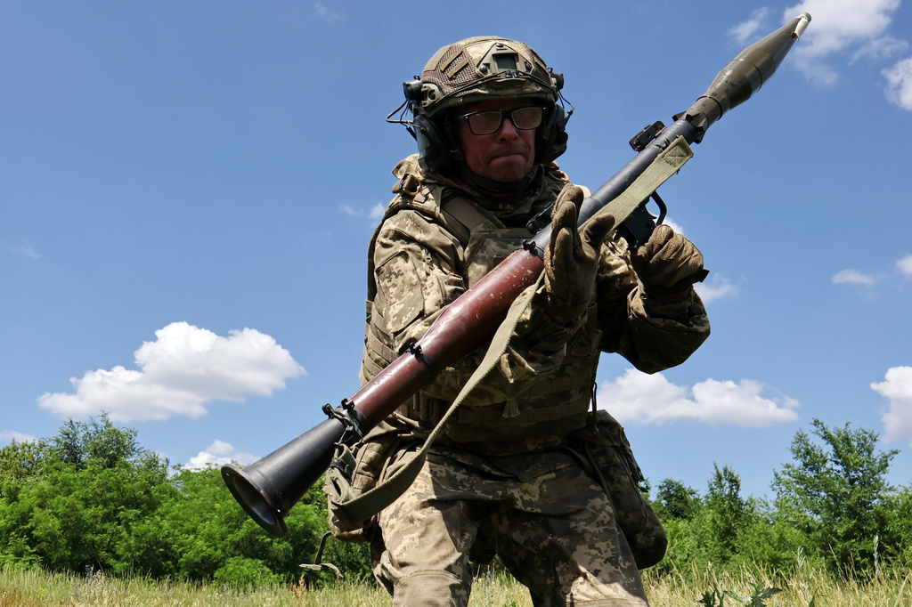 In this photo provided by Ukraine's 65th Mechanized Brigade press service, a soldier practices military skills at a training ground near the frontline in the Zaporizhzhia region, Ukraine, Saturday, June 20, 2026. (Andriy Andriyenko/Ukraine's 65th Mechanized Brigade via AP)