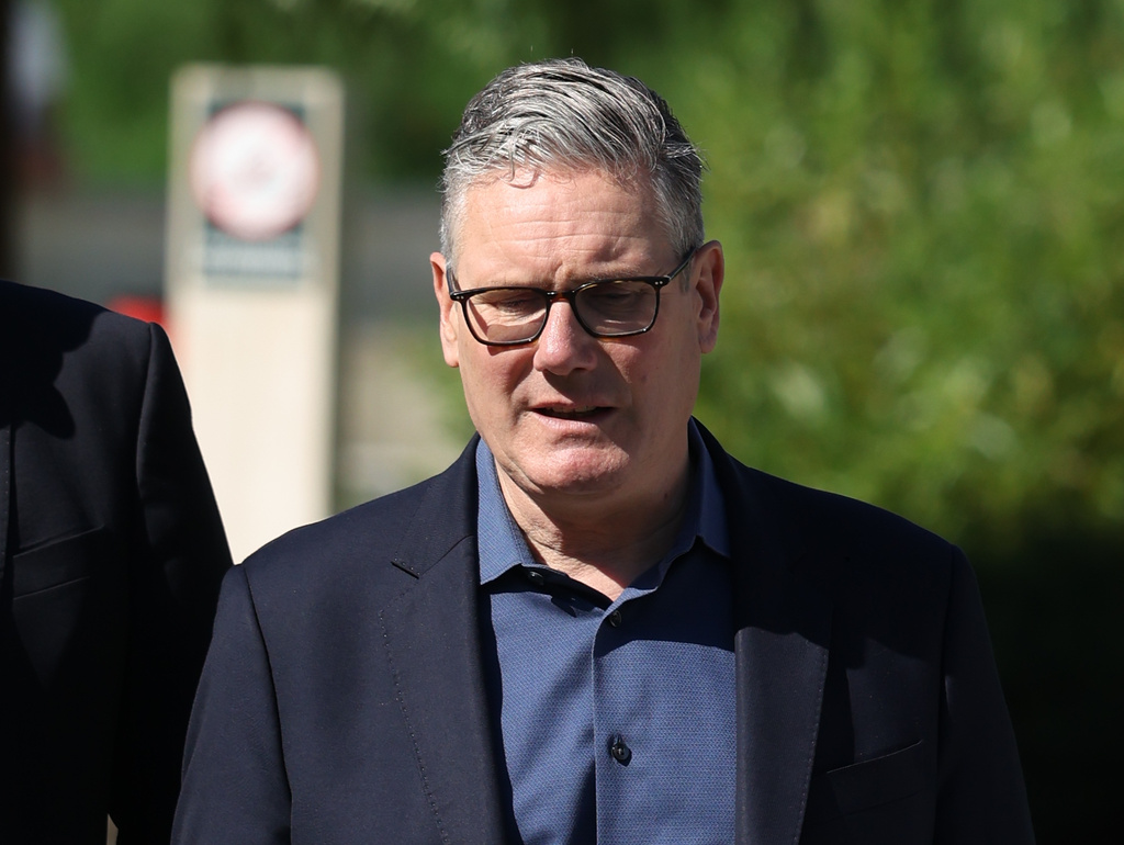 Britain's Prime Minister Keir Starmer walks, as he visits a housing development in north London, Friday, June 19, 2026. (Peter Macdiarmid/Pool Photo via AP)