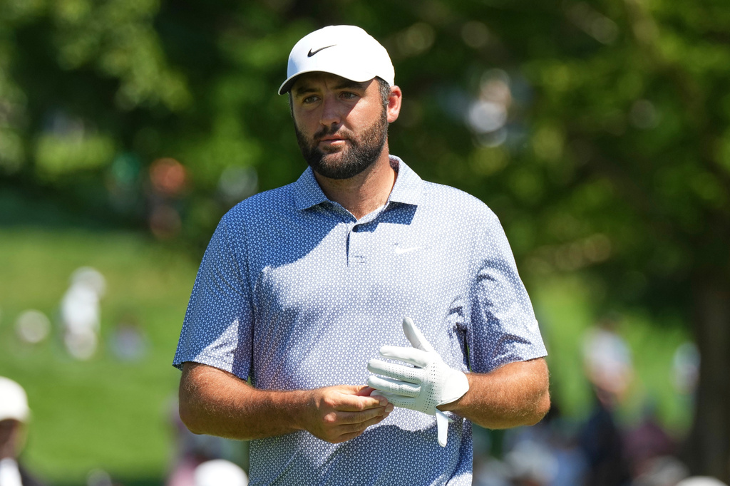 Scottie Scheffler walks to the fifth hole during the first round of the BMW Championship golf tournament Thursday, Aug. 20, 2026, in St. Louis. (AP Photo/Jeff Roberson)