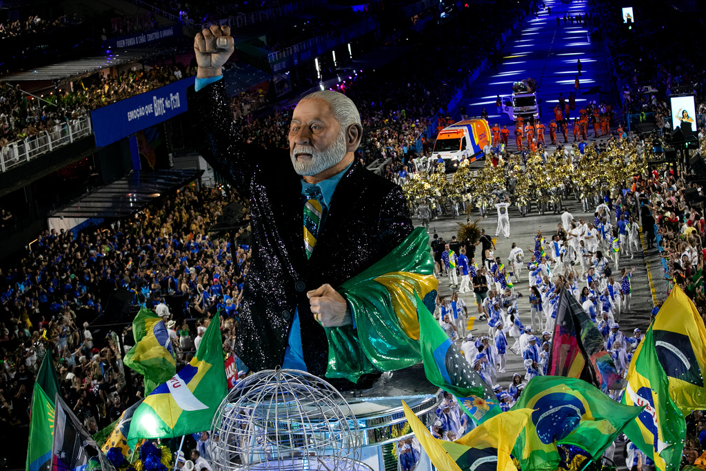 Performers from the Academicos de Niteroi samba school parade on a float with a sculpture of President Luiz Inacio Lula da Silva during Carnival celebrations at the Sambadrome, in Rio de Janeiro, Sunday, Feb. 15, 2026. (AP Photo/Bruna Prado)