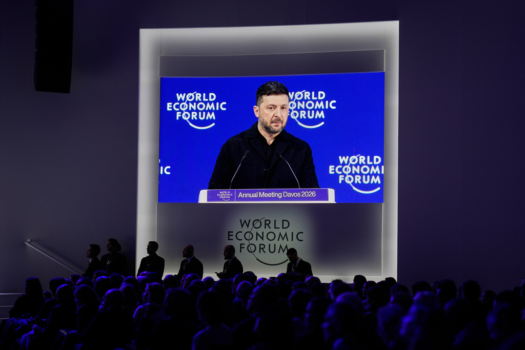 Ukraine's President Volodymyr Zelenskyy appears on a screen as he delivers a speech at the Annual Meeting of the World Economic Forum in Davos, Switzerland, Thursday, Jan. 22, 2026. (AP Photo/Markus Schreiber)