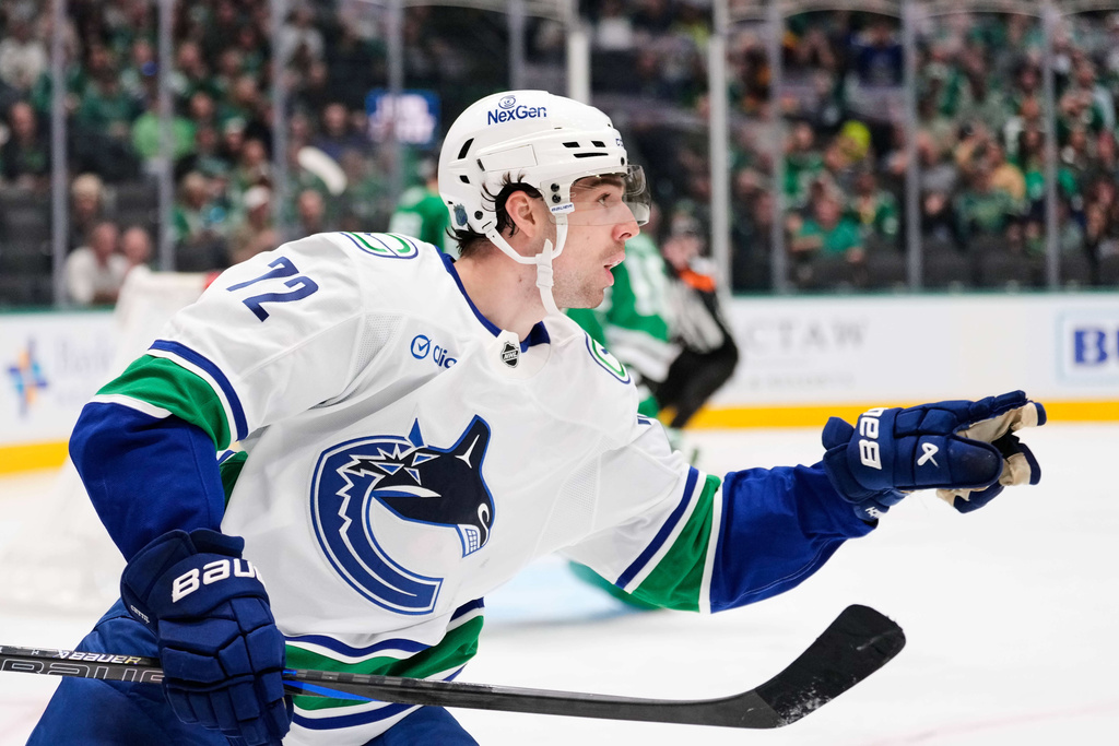 Vancouver Canucks center Filip Chytil (72) celebrates after scoring in the second period of an NHL hockey game against the Dallas Stars Thursday, Oct. 16, 2025, in Dallas. (AP Photo/Tony Gutierrez)