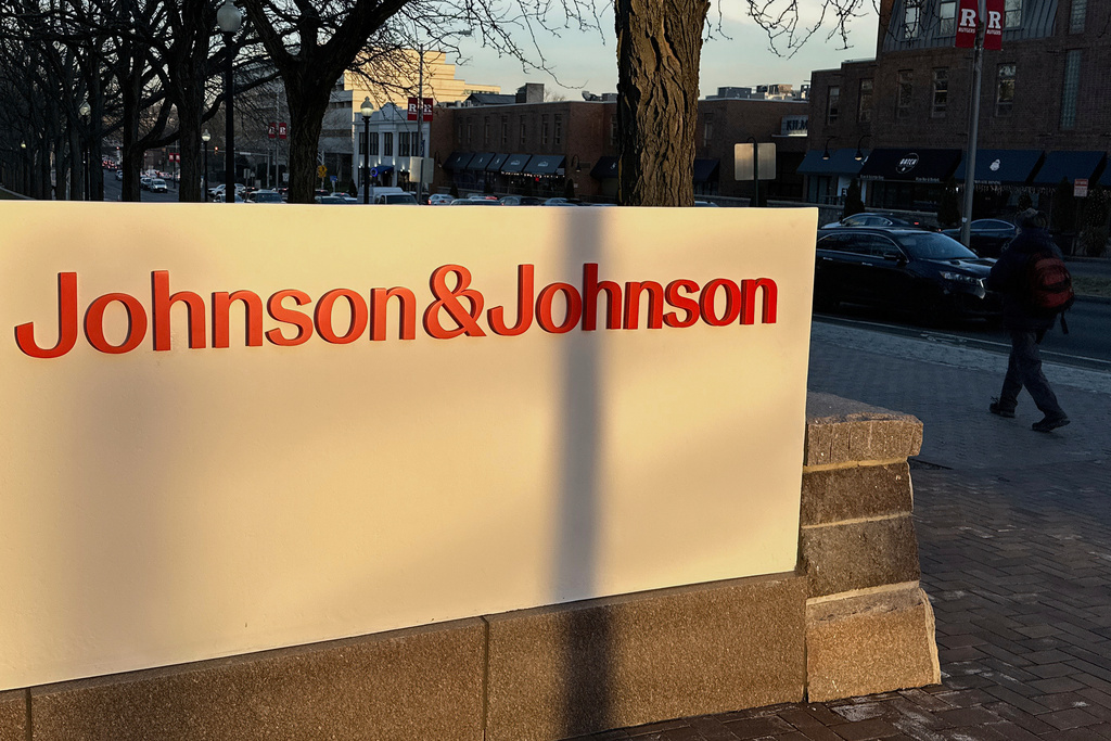 FILE - A person walks by the Johnson & Johnson headquarters is in New Brunswick, N.J., on Feb. 8, 2024. (AP Photo/Ted Shaffrey, File)
