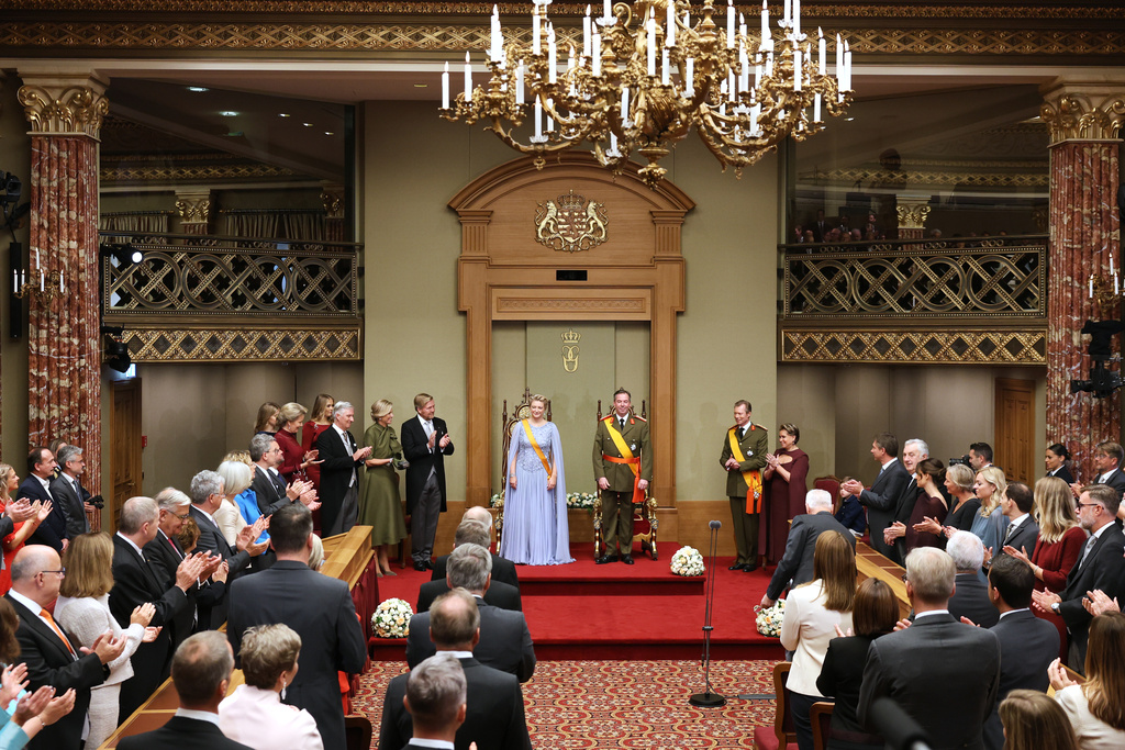 Luxembourg's Grand Duke Guillaume, center right, and Luxembourg's Grand Duchess Stephanie, center left, during a swearing-in ceremony in the session hall of the Chamber of Deputies in Luxembourg, Friday, Oct. 3, 2025. (AP Photo/Omar Havana)