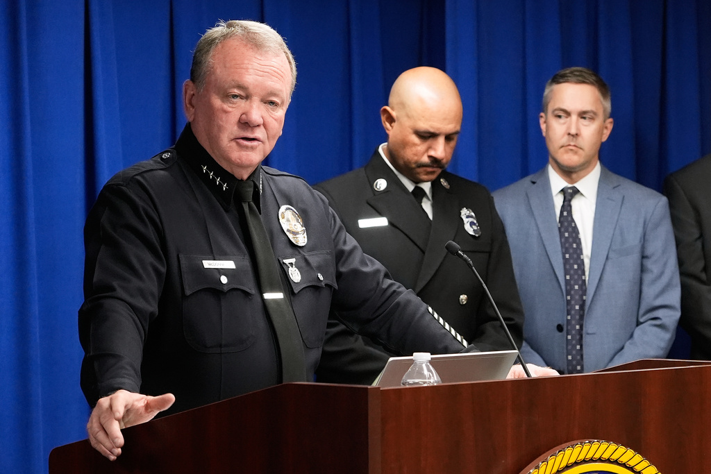 Los Angeles Police Chief Jim McDonnell, left, speaks during a news conference announcing an arrest made in the Palisades Fire, Wednesday, Oct. 8, 2025, in Los Angeles. (AP Photo/Damian Dovarganes)