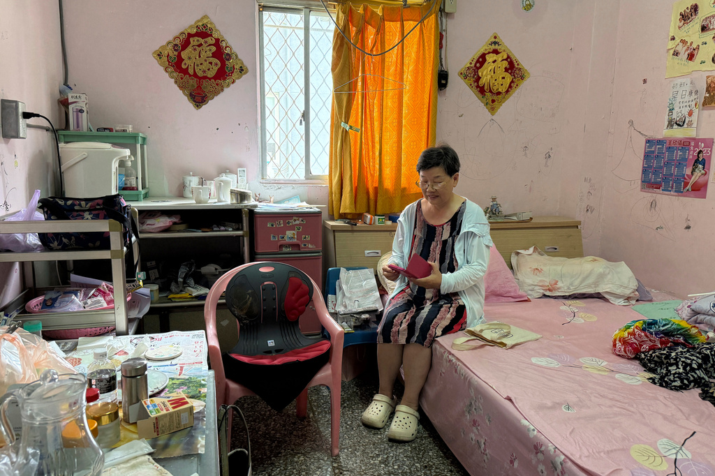 Mi Zhengrong sits in her room in Taipei, Taiwan, on July 20, 2026. (AP Photo/Johnson Lai)