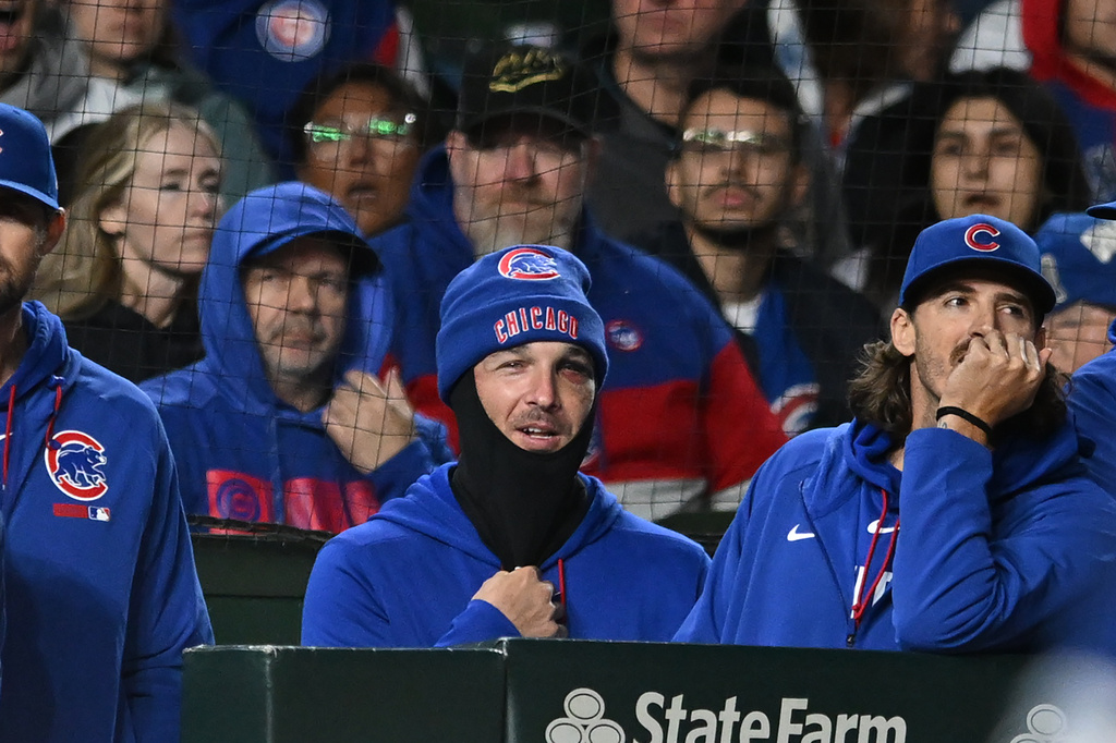 Chicago Cubs' Alex Bregman, center, looks on from the dugout during the ninth inning of a baseball game against the Miami Marlins Tuesday, Sept. 22, 2026, in Chicago. (AP Photo/Paul Beaty)