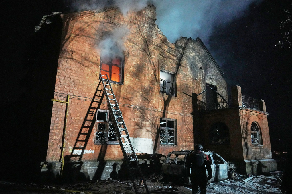A residential building burns after a Russian strike in Kyiv, Ukraine, Friday, Jan. 9, 2026. (AP Photo/Efrem Lukatsky)