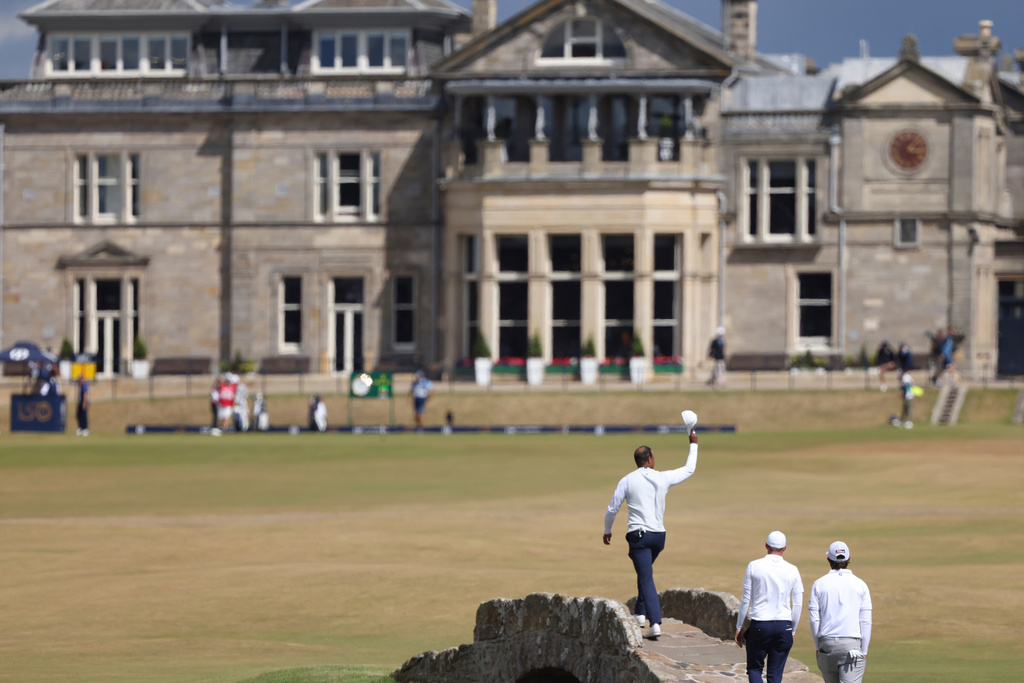 FILE - Tiger Woods of the U.S. gestures to the crowd at the end of his second round of the British Open golf championship on the Old Course, in St. Andrews, Scotland, Friday July 15, 2022. (AP Photo/Peter Morrison, File)
