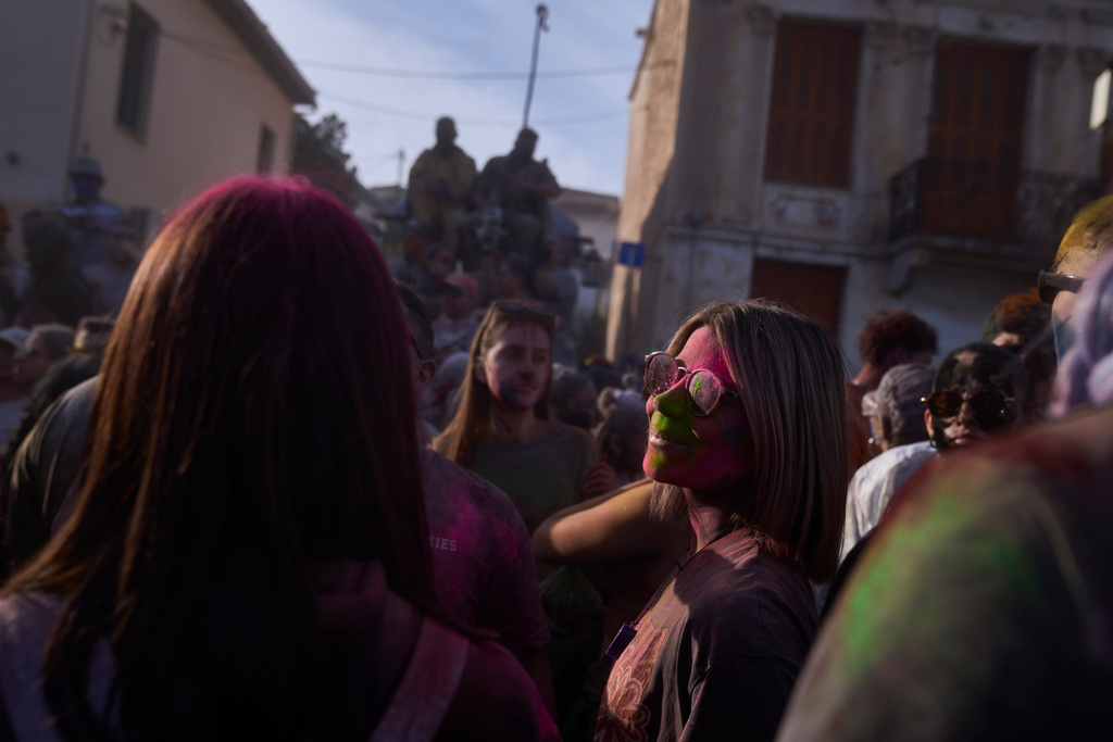 Revelers take part in the annual flour war marking the end of the Carnival season on Clean Monday in Galaxidi, about 200 kilometers (120 miles) west of Athens, Feb. 23, 2026, at the start of the 40-day Christian Lent fast leading to Easter. (AP Photo/Petros Giannakouris)