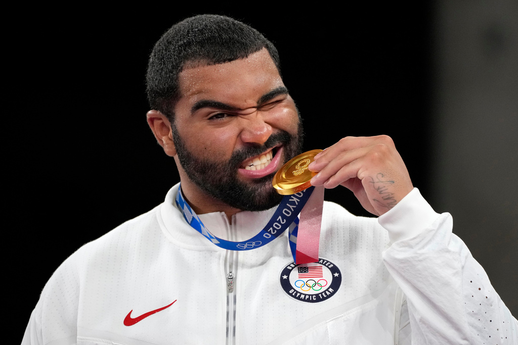 FILE - In this Aug. 6, 2021, file photo, United State's Gable Dan Steveson poses with his gold medal during the medal ceremony for the men's freestyle 125kg wrestling at the 2020 Summer Olympics, in Chiba, Japan.(AP Photo/Aaron Favila, File)
