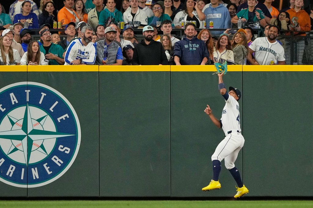 Seattle Mariners center fielder Julio Rodriguez catches a fly out from Colorado Rockies' Jordan Beck during the sixth inning of a baseball game, Tuesday, Sept. 23, 2025, in Seattle. (AP Photo/Ryan Sun)
