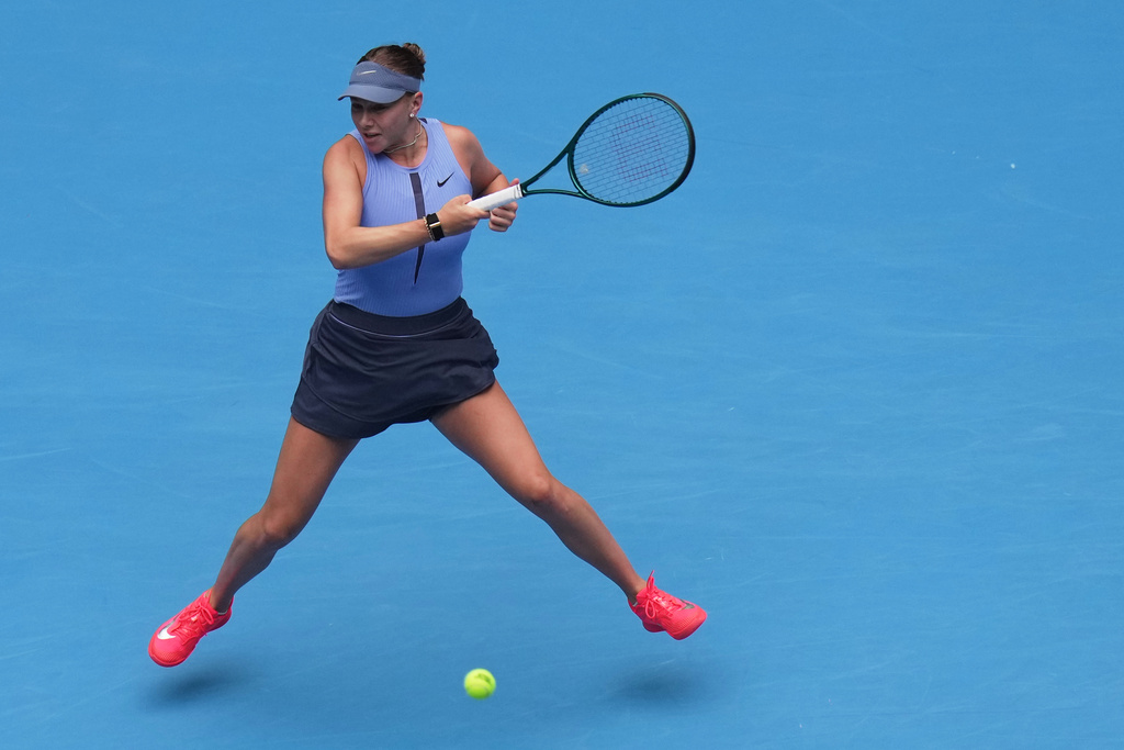 Amanda Anisimova, of the United States plays a forehand return to her compatriot Coco Gauff during the women's singles semifinals match of the China Open tennis tournament, at the National Tennis Center, in Beijing, Saturday, Oct. 4, 2025. (AP Photo/Andy Wong)