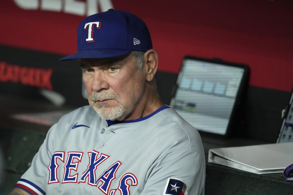 Texas Rangers manager Bruce Bochy pauses in the team dugout prior to a baseball game against the Arizona Diamondbacks Tuesday, Sept. 2, 2025, in Phoenix. (AP Photo/Ross D. Franklin)