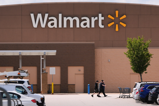 FILE - Shoppers walk from the Walmart store, Aug. 14, 2025, in Manchester, N.H. (AP Photo/Charles Krupa, File) FILE - Shoppers walk from the Walmart store, Aug. 14, 2025, in Manchester, N.H. (AP Photo/Charles Krupa, File)
