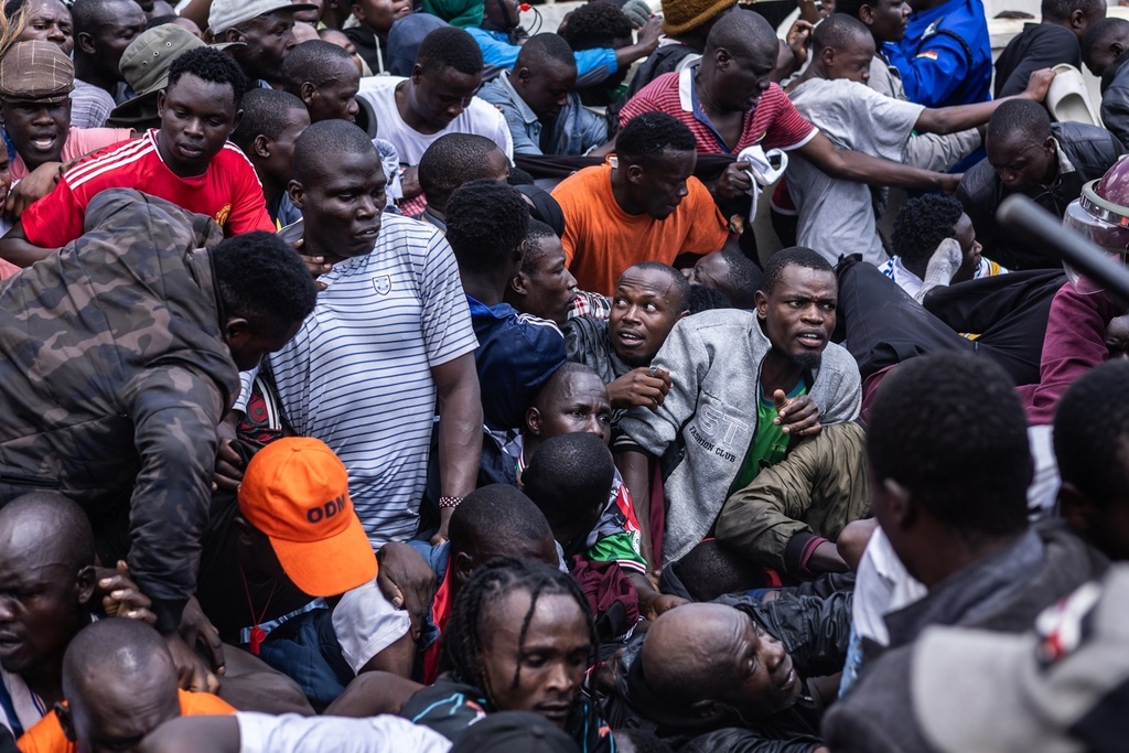 People get caught in a stampede as they attend the state funeral of former Kenya Prime Minister Raila Odinga at Nyayo National Stadium in Nairobi, Kenya, Friday, Oct. 17, 2025. (AP Photo/Samson Otieno)