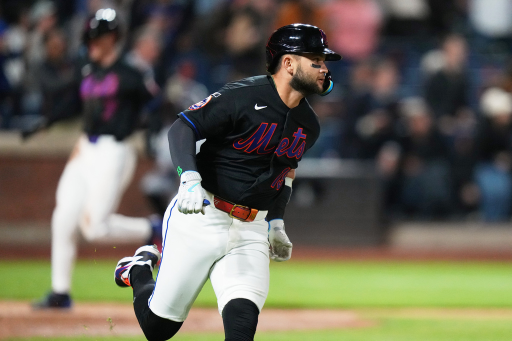New York Mets' Bo Bichette runs to second base for a three-run double during the eighth inning of a baseball game against the Minnesota Twins Thursday, April 23, 2026, in New York. (AP Photo/Frank Franklin II)