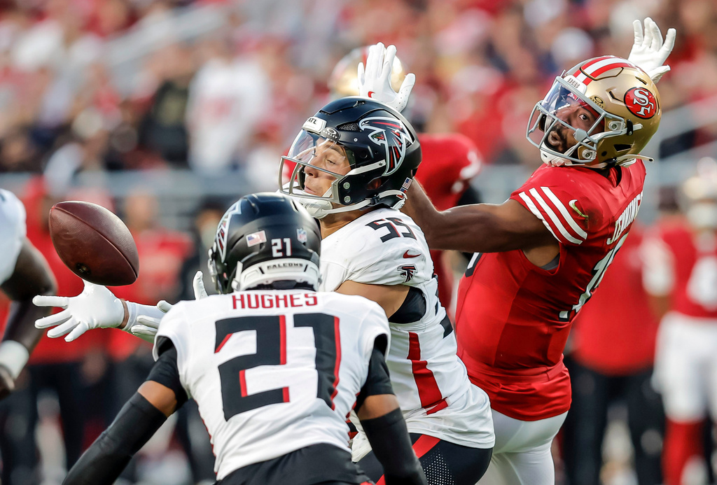 Atlanta Falcons' Kaden Eliss (55) reaches up to intercept a ball bobbled by San Francisco 49ers' Jauan Jennings in the first half of an NFL football game in Santa Clara, Calif., on Sunday, Oct. 19, 2025. (Carlos Avila Gonzalez/San Francisco Chronicle via AP)