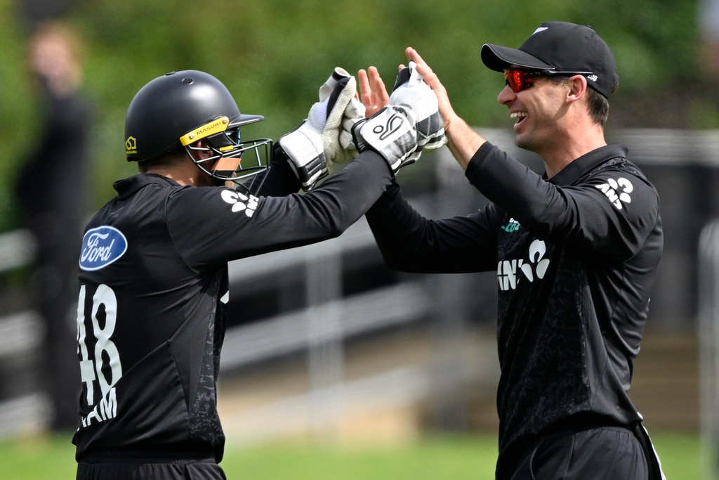 New Zealand's Tom Latham, left, celebrates with teammate Will Young after the dismissal of England's Harry Brook during their T20 cricket match in Hamilton, New Zealand, Wednesday, Oct. 29, 2025. (Andrew Cornaga/Photosport via AP)