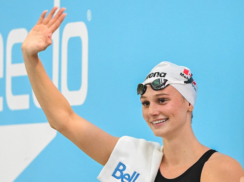Summer McIntosh waves to fans after setting a new world in the women's 200m butterfly final at the Canadian Swimming Trials in Montreal, on Sunday, July 5, 2026. (Graham Hughes/The Canadian Press via AP)