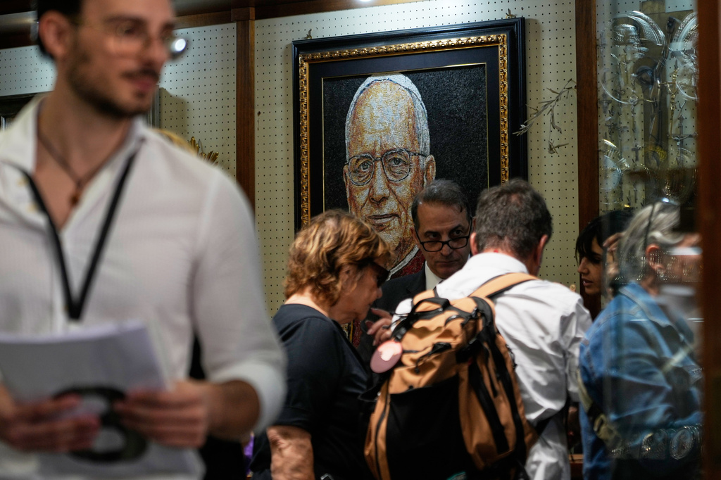 A mosaic of Pope Leo XIV is displayed inside a shop selling religious items near St. Peter's Square, in Rome, Monday, Oct. 12, 2026. (AP Photo/Gregorio Borgia)