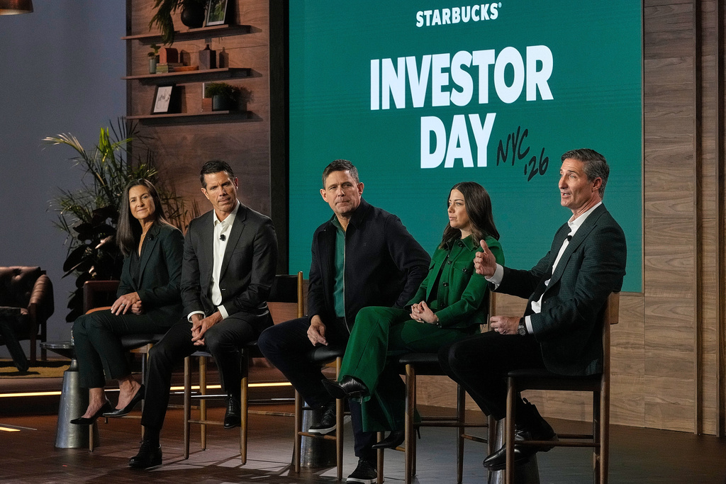 Starbucks Chairman and CEO Brian Niccol, right, speaks during the Starbucks Investor Day event, in New York, Thursday, Jan. 29, 2026. He is accompanied by, from left: CFO Cathy Smith; International CEO Brady Brewer; COO Mike Grams; and Chief Brand Officer Tressie Lieberman. (AP Photo/Richard Drew)