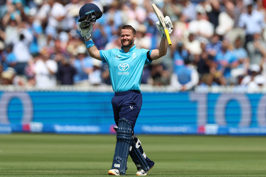 England's Ben Duckett celebrates reaching his century during the third ODI between England and India, at Lord's cricket ground, London, Sunday, July 19, 2026. (Steven Paston/PA via AP)