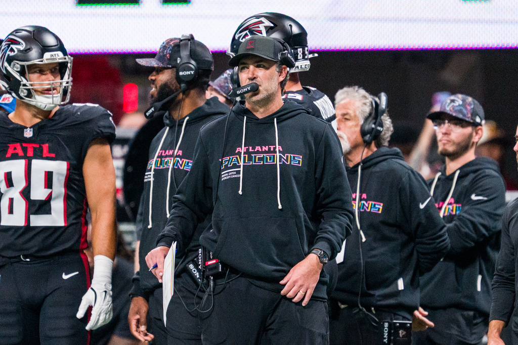 FILE - Atlanta Falcons offensive coordinator Zac Robinson works during the first half of an NFL football game against the Washington Commanders, Sunday, Sep. 28, 2025, in Atlanta. (AP Photo/Danny Karnik, File)