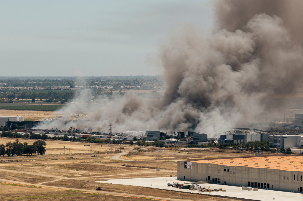 Smoke is seen from the massive fire at the Medline medical supply warehouse in Tracy, Calif., Friday, June 12, 2026. (Stephen Lam/San Francisco Chronicle via AP)