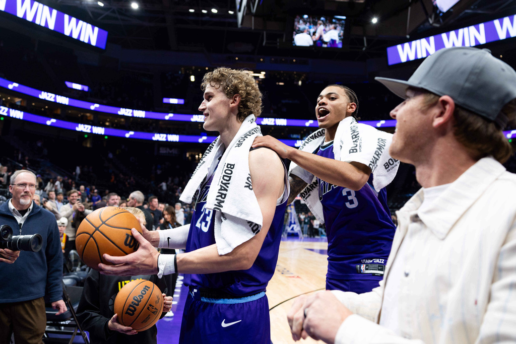 Utah Jazz forward Lauri Markkanen (23) celebrates with guard Keyonte George (3) after an NBA basketball game, Monday, Oct. 27, 2025, in Salt Lake City. (AP Photo/Anna Fuder)