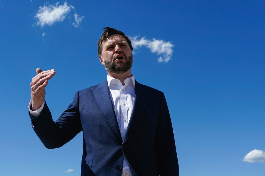 Vice President JD Vance speaks to reporters at Joint Base Andrews, Md., Saturday, June 20, 2026, en route to Switzerland. (Elizabeth Frantz/Pool Photo via AP)