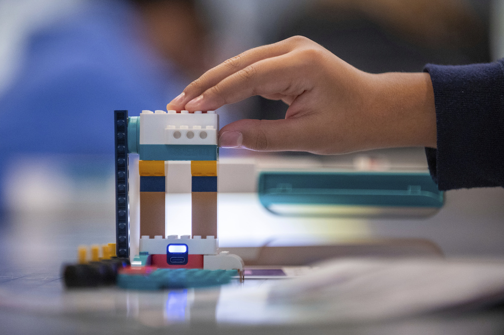 Analyssa Ramirez works on a project during a LEGO Education science lesson at Lorenzo De Zavala Middle School on Thursday, Aug. 21, 2025, in Irving, Texas. (AP Photo/Ronaldo Bolaños)