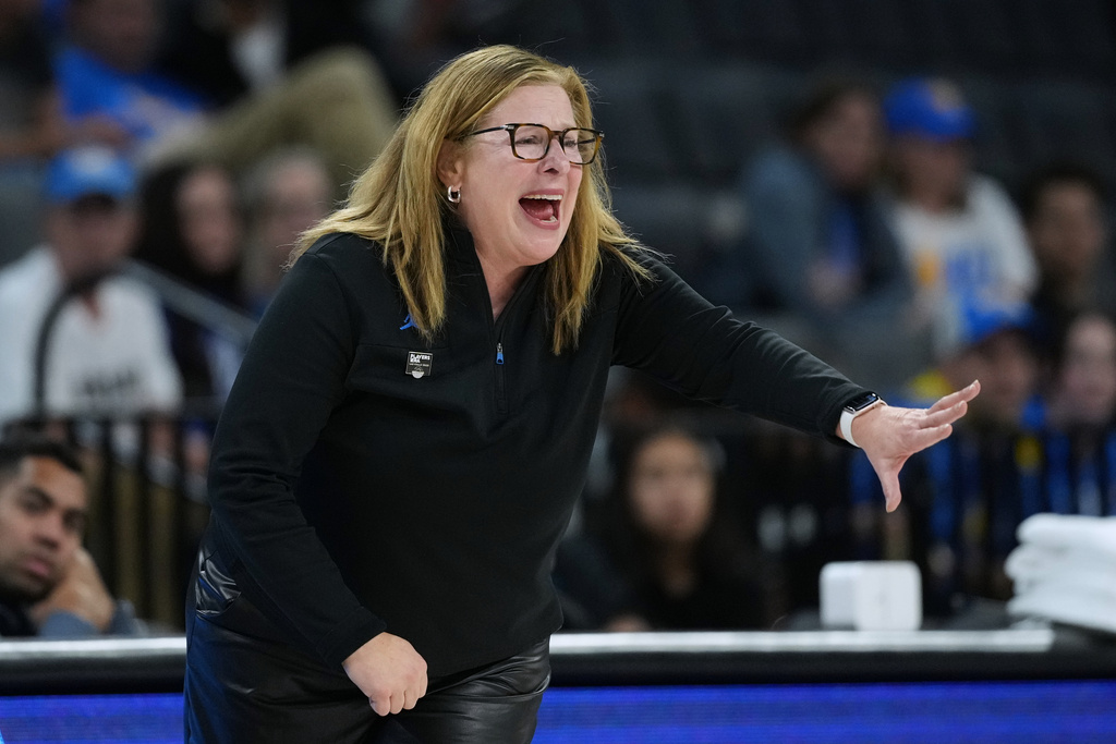 UCLA head coach Cori Close talks to her players during the first half of an NCAA college basketball game against Duke in the Players Era tournament in Las Vegas, Thursday, Nov. 27, 2025. (AP Photo/Eric Gay)