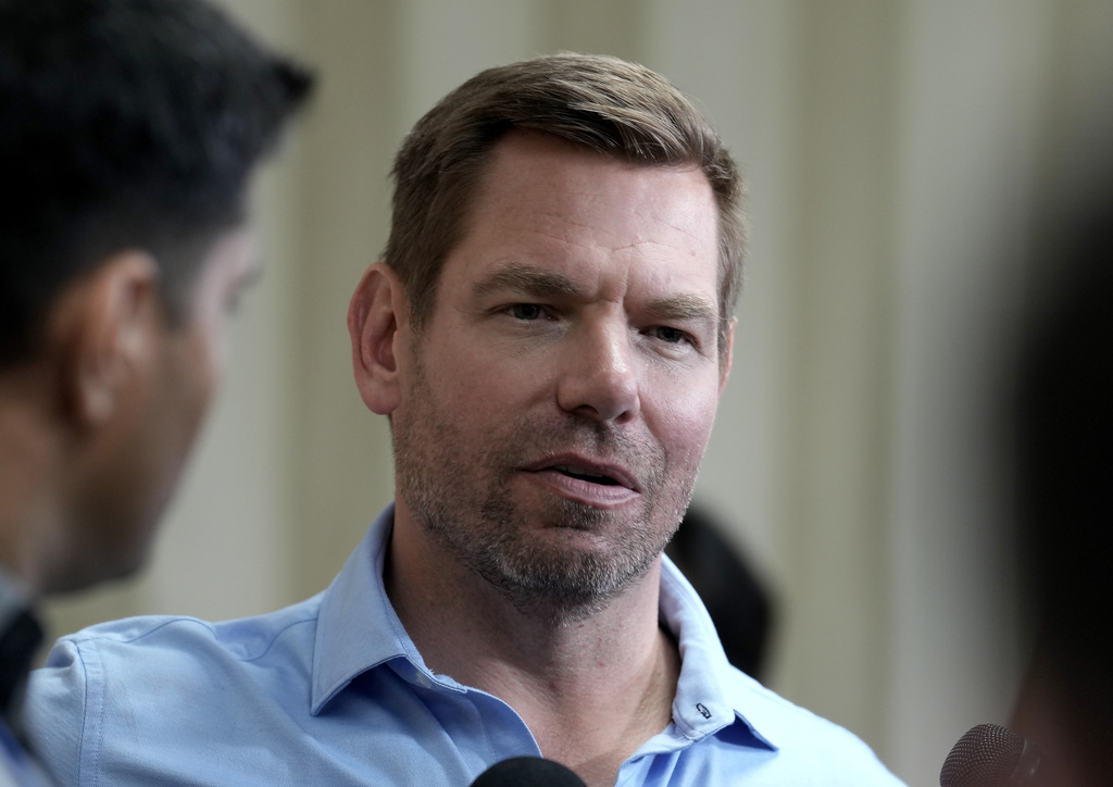 California gubernatorial candidate Rep. Eric Swalwell, D-Calif., talks with reporters after holding a town hall meeting in Sacramento, Calif., Tuesday, April 7, 2026. (AP Photo/Rich Pedroncelli)