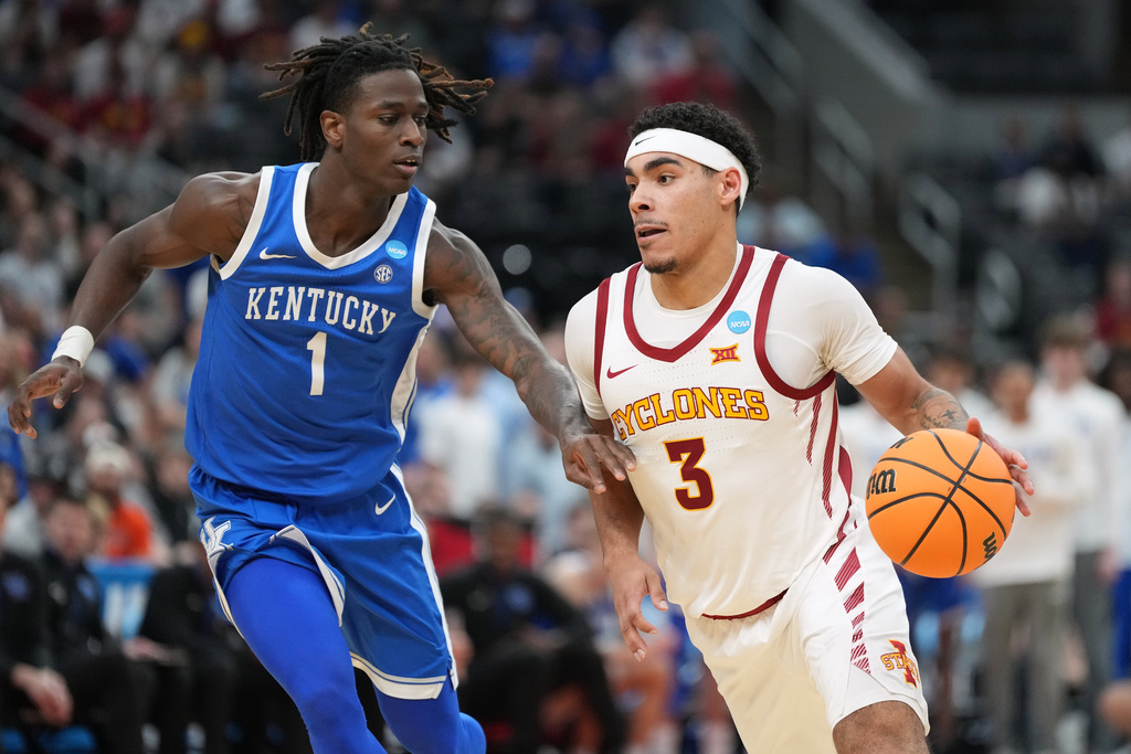 Iowa State's Tamin Lipsey (3) drives past Kentucky's Denzel Aberdeen (1) during the second half in the second round of the NCAA college basketball tournament, Sunday, March 22, 2026, in St. Louis. (AP Photo/Jeff Roberson)