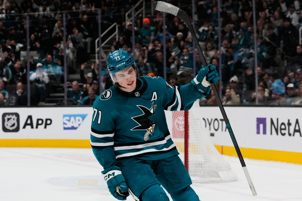 San Jose Sharks center Macklin Celebrini celebrates after scoring in the shoot-out of an NHL hockey game against the Minnesota Wild, Wednesday, Dec. 31, 2025, in San Jose, Calif. (AP Photo/Godofredo A. Vásquez)